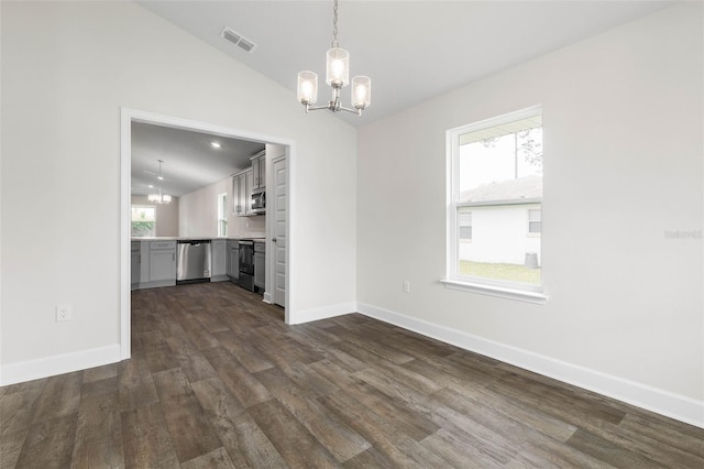 48 Bannbury Ln, Palm Coast, FL 32137 - unfurnished living room featuring lofted ceiling, a chandelier, dark wood-style floors, and baseboards