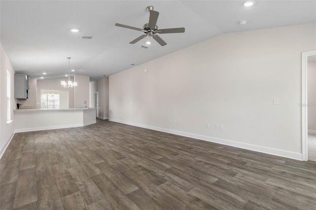 48 Bannbury Ln, Palm Coast, FL 32137 - unfurnished living room with lofted ceiling, a chandelier, dark wood finished floors, ceiling fan, and recessed lighting