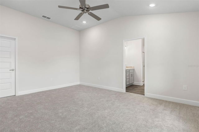 48 Bannbury Ln, Palm Coast, FL 32137 - unfurnished bedroom with lofted ceiling, carpet, baseboards, recessed lighting, and ensuite bathroom