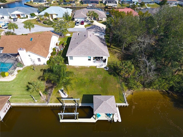 bird's eye view with a water view and a residential view