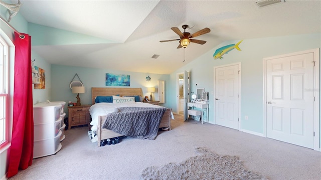 carpeted bedroom featuring vaulted ceiling and ceiling fan