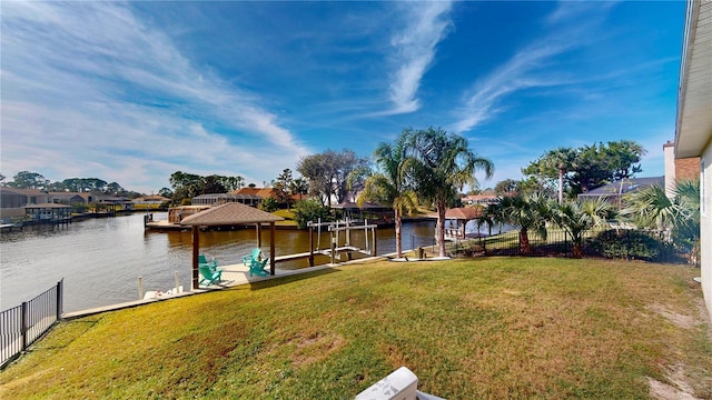 dock area featuring a yard and a water view