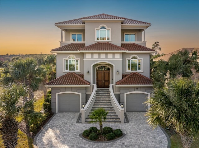 mediterranean / spanish house featuring a garage