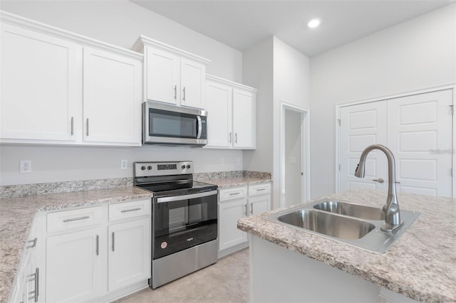 kitchen featuring sink, white cabinetry, and appliances with stainless steel finishes