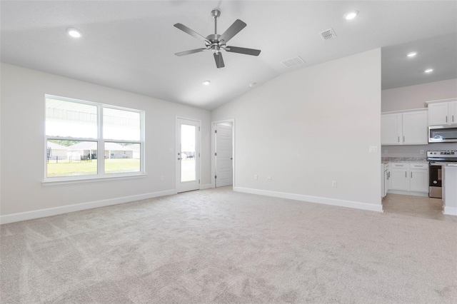 unfurnished living room with ceiling fan, light colored carpet, and lofted ceiling