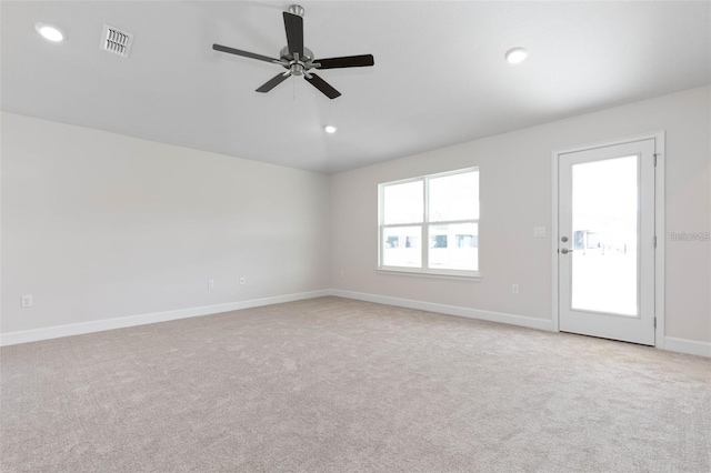 unfurnished room featuring ceiling fan and light colored carpet