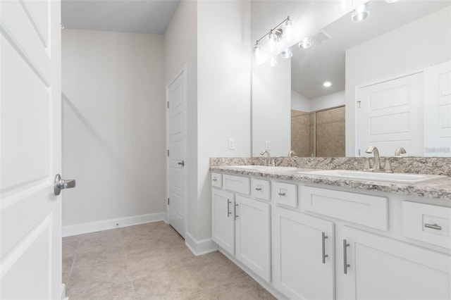 bathroom featuring walk in shower and vanity