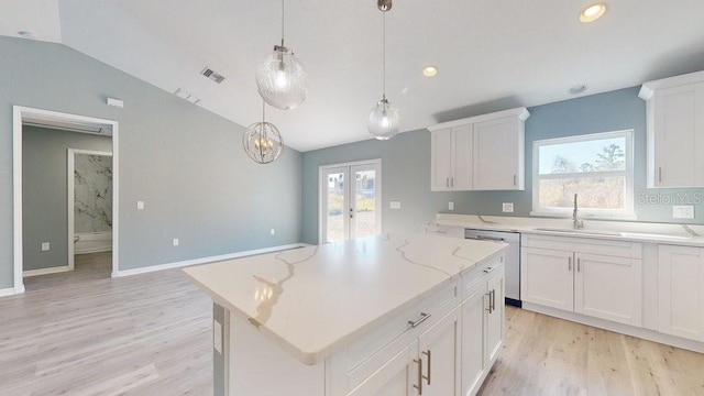 kitchen featuring sink, hanging light fixtures, a center island, white cabinets, and stainless steel dishwasher