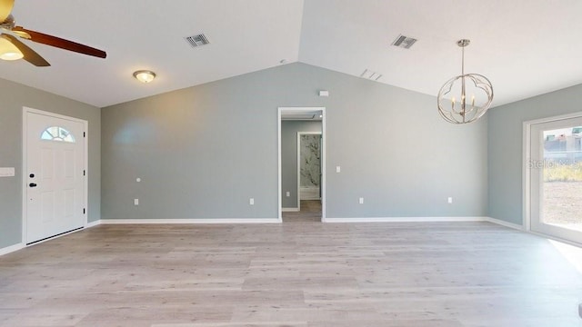 interior space with ceiling fan with notable chandelier, vaulted ceiling, and light hardwood / wood-style floors