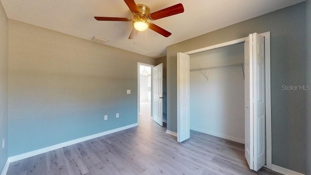 unfurnished bedroom featuring a closet, ceiling fan, and light hardwood / wood-style flooring