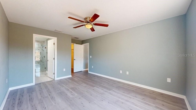 unfurnished bedroom with ensuite bathroom, ceiling fan, and light hardwood / wood-style floors