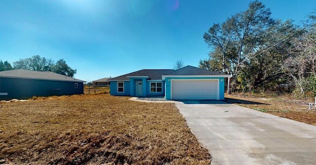 single story home with a garage