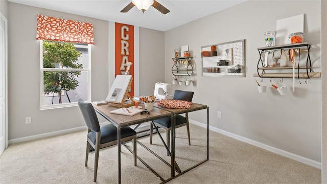 carpeted office space featuring ceiling fan and a wealth of natural light