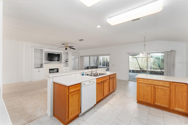 kitchen with vaulted ceiling, a kitchen island, sink, ceiling fan, and white dishwasher