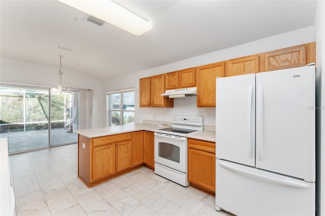 kitchen featuring hanging light fixtures, white appliances, vaulted ceiling, and kitchen peninsula