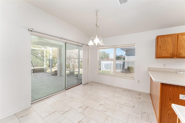 unfurnished dining area with lofted ceiling and an inviting chandelier