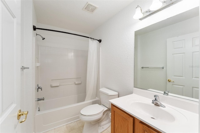 full bathroom featuring vanity, toilet, tile patterned flooring, and shower / bath combo