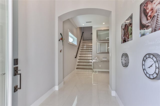 hall featuring light tile patterned floors