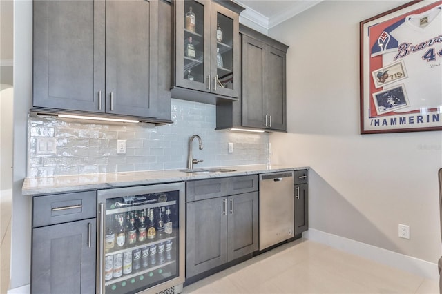 kitchen featuring sink, light stone counters, tasteful backsplash, dishwasher, and beverage cooler