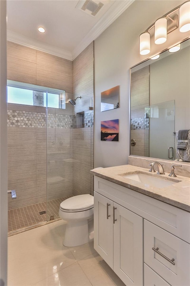 bathroom featuring an enclosed shower, vanity, crown molding, and toilet