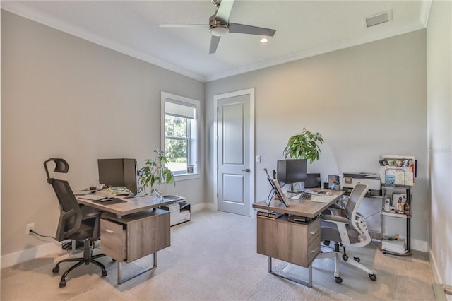 carpeted office featuring ornamental molding and ceiling fan