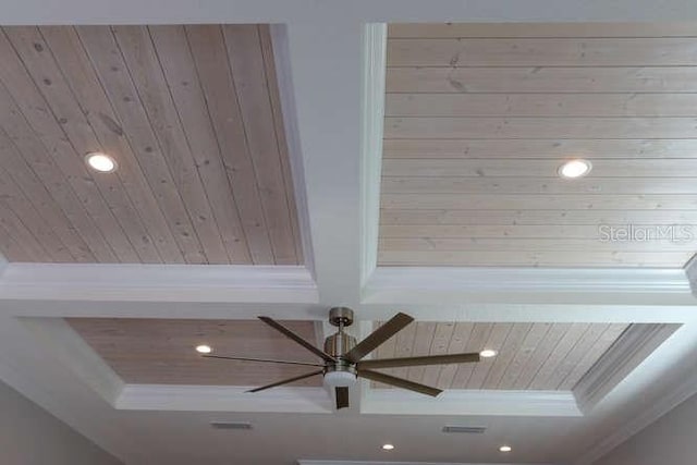 room details featuring wood ceiling, ceiling fan, ornamental molding, and a raised ceiling