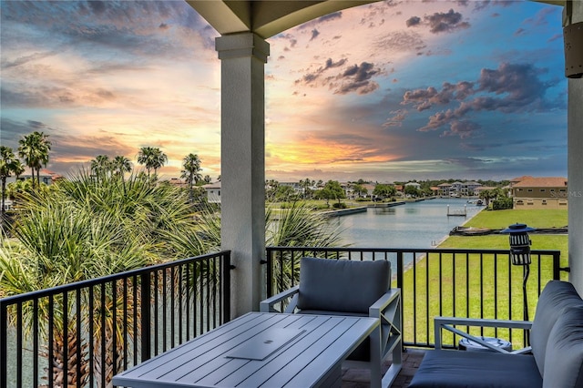 balcony at dusk with a water view