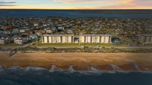 aerial view at dusk with a water view