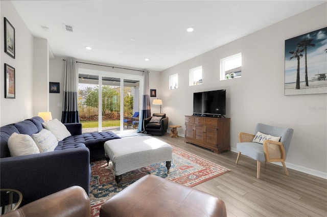 living room with light hardwood / wood-style floors