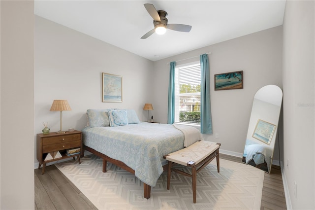 bedroom featuring ceiling fan and hardwood / wood-style floors