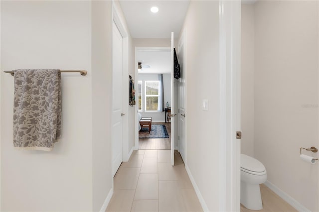 bathroom featuring tile patterned flooring and toilet