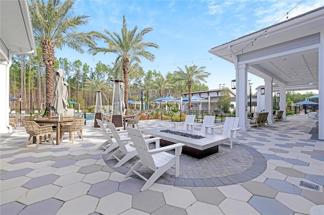view of patio with a fire pit