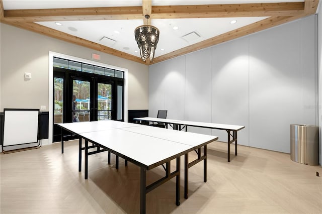 recreation room featuring light parquet floors, an inviting chandelier, beam ceiling, and french doors