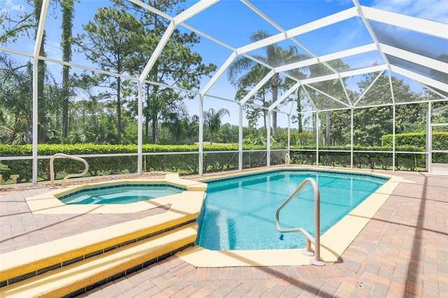 view of swimming pool featuring a patio and glass enclosure