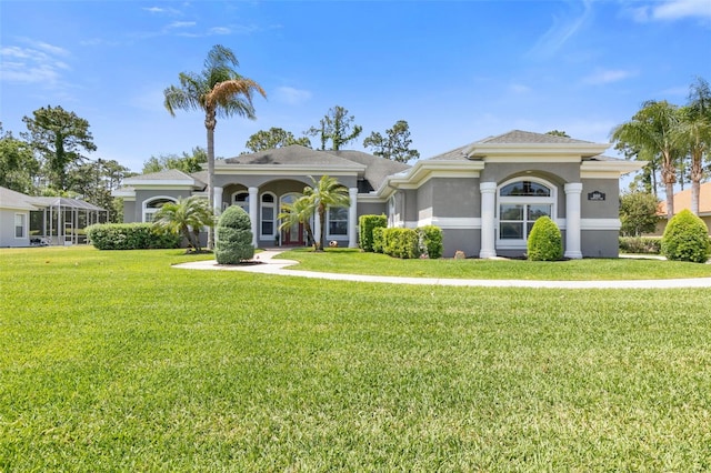 mediterranean / spanish-style house featuring a front lawn