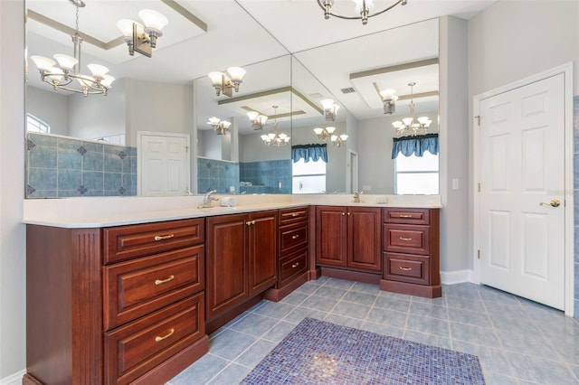 bathroom featuring vanity, tile patterned flooring, a chandelier, and walk in shower