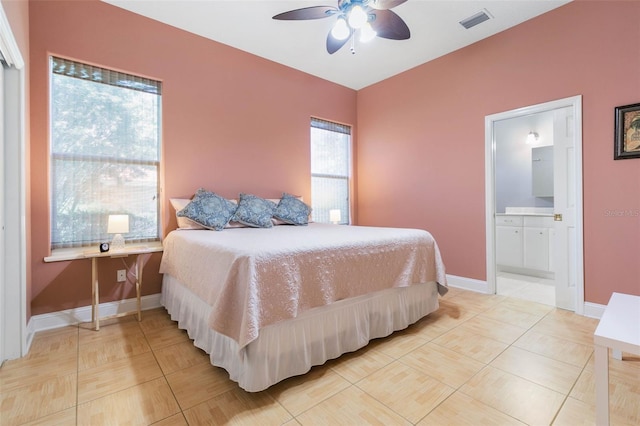 tiled bedroom featuring ceiling fan and ensuite bathroom