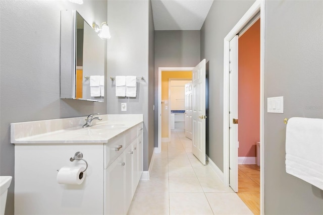 bathroom featuring tile patterned flooring and vanity