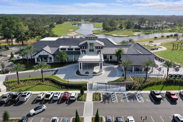 birds eye view of property with a water view