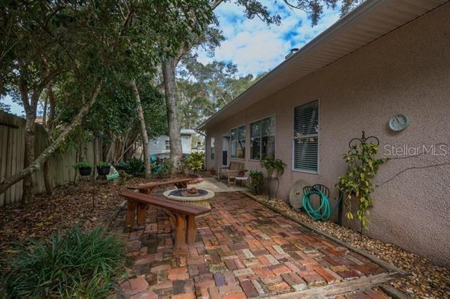 view of patio / terrace featuring an outdoor fire pit