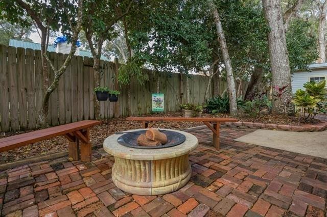 view of patio featuring an outdoor fire pit