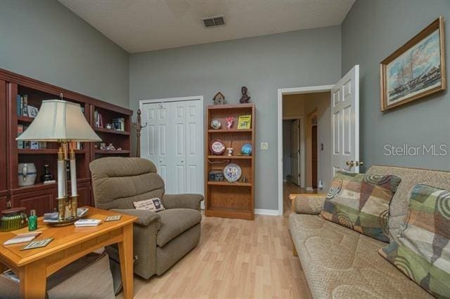 living room with light hardwood / wood-style flooring