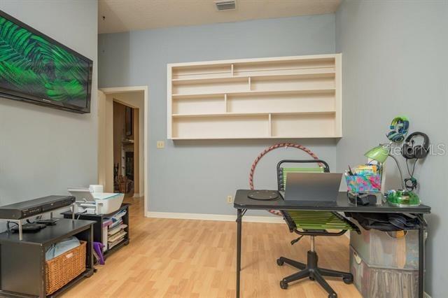 office space with wood-type flooring