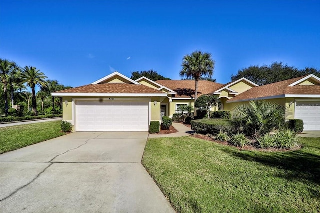 ranch-style house featuring a garage and a front yard