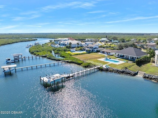 birds eye view of property featuring a water view