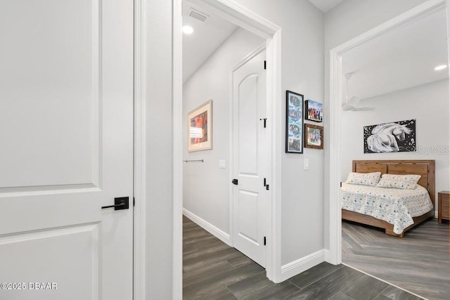 hall featuring dark wood-type flooring