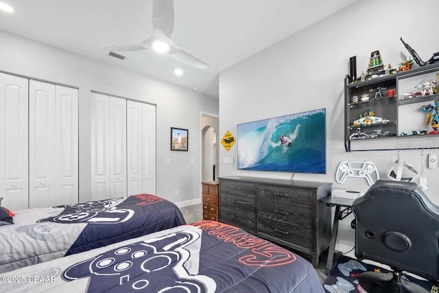 bedroom featuring two closets and ceiling fan