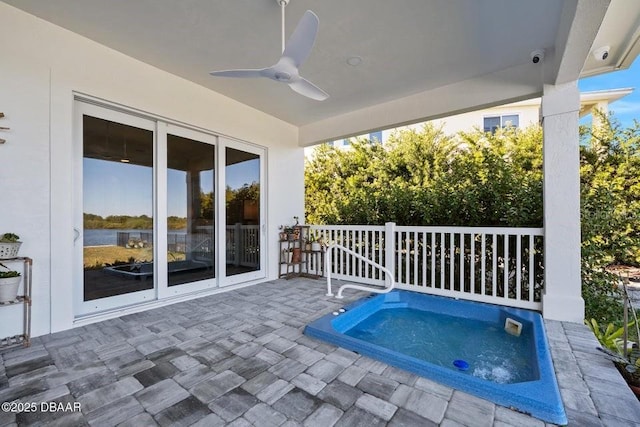 view of swimming pool featuring a patio, an in ground hot tub, and ceiling fan