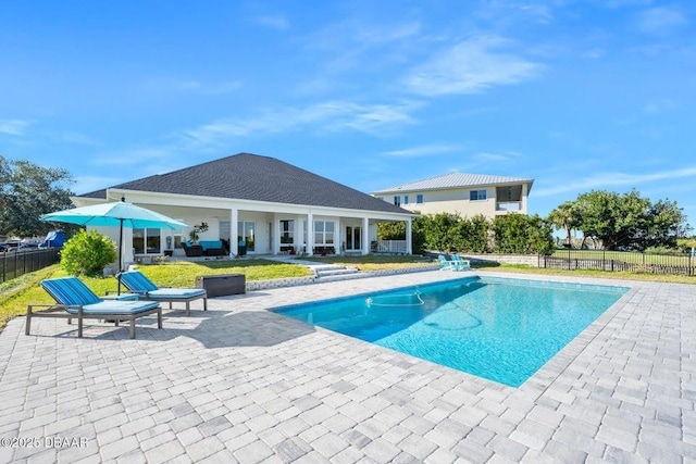 view of swimming pool featuring a patio