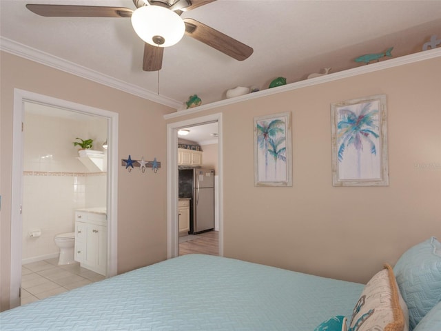 bedroom with light tile patterned flooring, ensuite bathroom, stainless steel refrigerator, ornamental molding, and ceiling fan